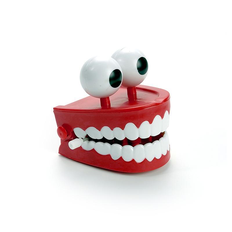 1 stuks clockwork jumping teeth red wind up grappige mondtand met ogen knipperende nieuwigheden trick toys